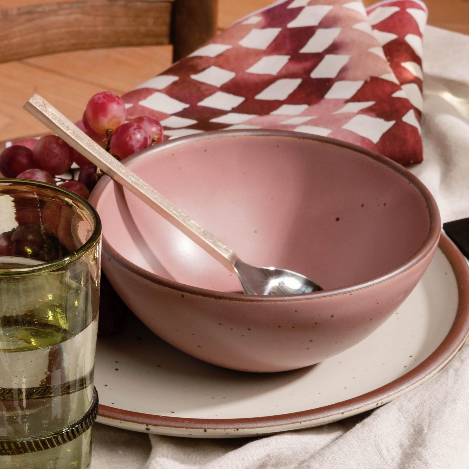 Goallo soup bowl in Lilac, in a table setting with other dinnerware