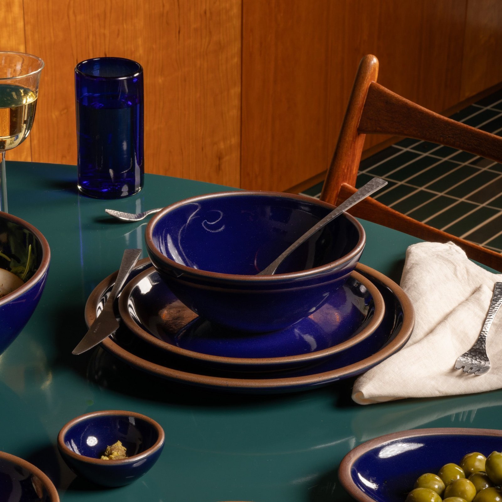 Goallo soup bowl in Midnight Navy, in a table setting with other dinnerware